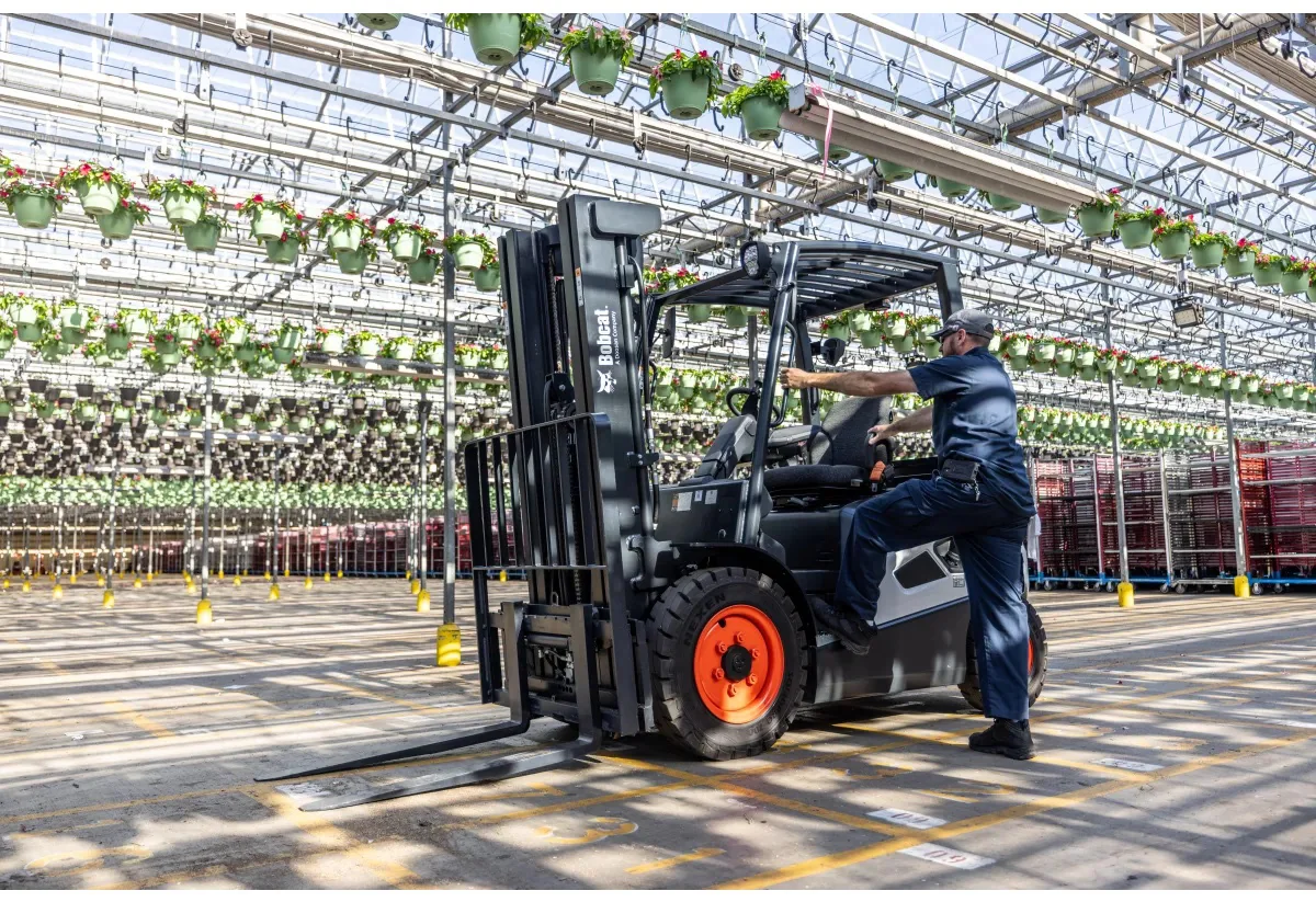 Bobcat forklift product photography in a greenhouse