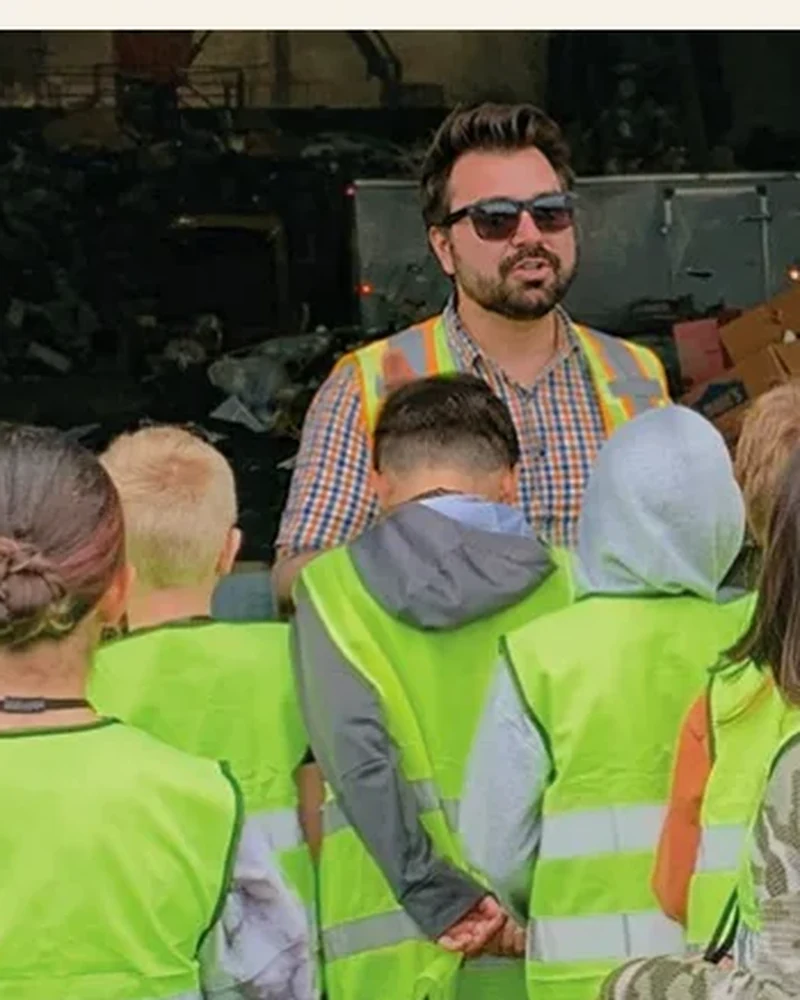 Kile Halliday speaking to a group during a workplace tour