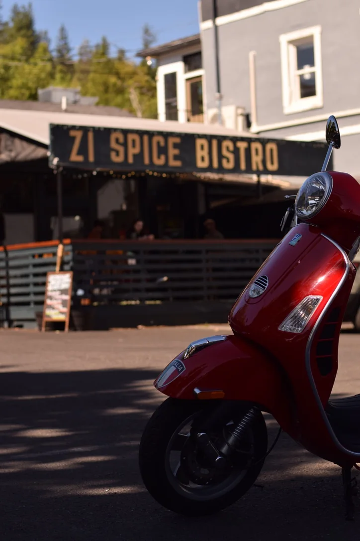 Restaurant exterior with a red scooter